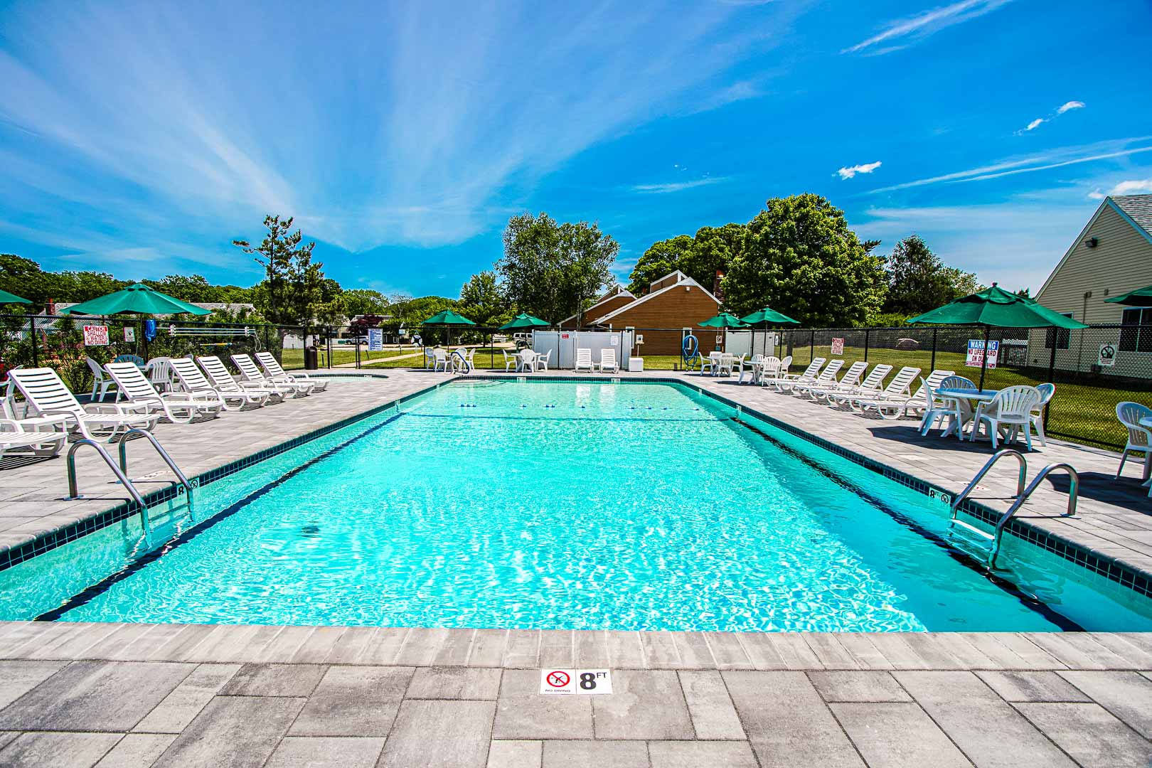 A crisp outdoor swimming pool at VRI's Brewster Green Resort in Massachusetts.